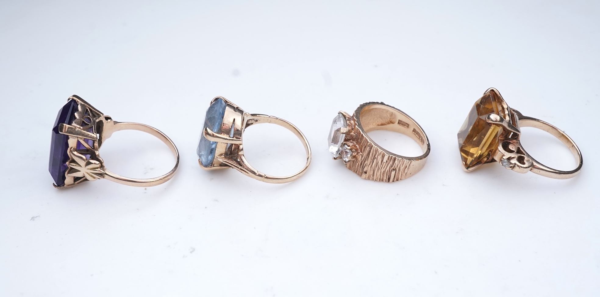 Four gem-set rings